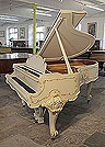 A 1979, Louis XV style, Steinway Model O grand piano for sale with an off-white case and ornately carved, cabriole legs. Entire cabinet features Rococo style, carvings accented with gilt detail. Piano comes with a matching piano stool. Piano has an eighty-eight note keyboard and a two-pedal lyre. 