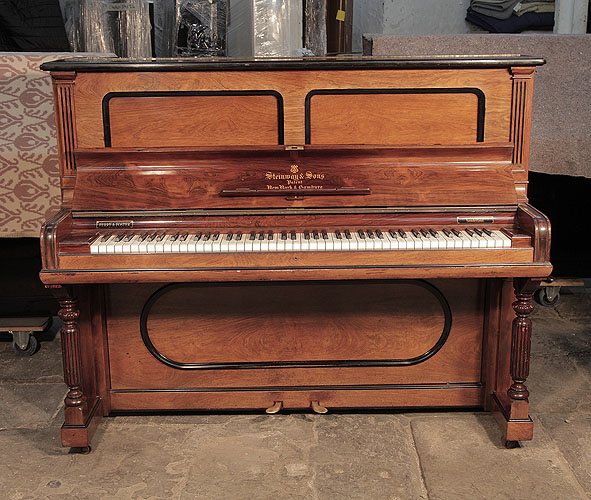 Antique, 1901, Steinway  upright piano for sale with a rosewood case and turned fluted legs. Cabinet features indented borders with black borders