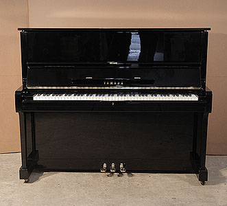  A 1978, Yamaha U1upright piano with a black case and polyester finish. Piano has an eighty-eight note keyboard and three pedals.