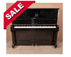 Reconditioned, 1962, Yamaha U2 upright piano with a black case and brass fittings