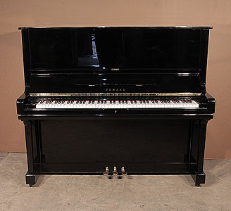  A 1972, Yamaha U3 upright piano with a black case and polyester finish. Piano has an eighty-eight note keyboard and three pedals.