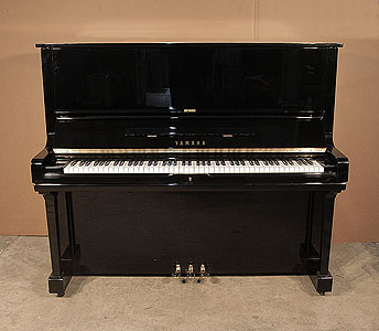  A 1973, Yamaha U3 upright piano with a black case and polyester finish. Piano has an eighty-eight note keyboard and three pedals.