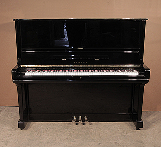  A 1975, Yamaha U3 upright piano with a black case and polyester finish. Piano has an eighty-eight note keyboard and three pedals.