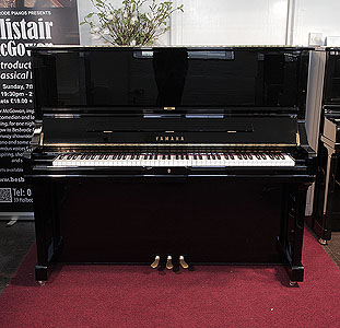  A 2006,  Yamaha U3S upright piano for sale with a black case and brass fittings. Piano has an eighty-eight note keyboard and three pedals.