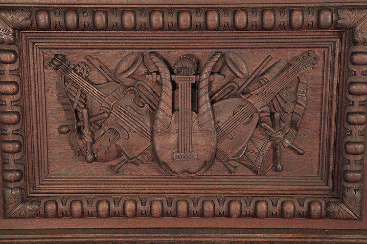 Georg Fortner front panel carved with musical instruments in high relief