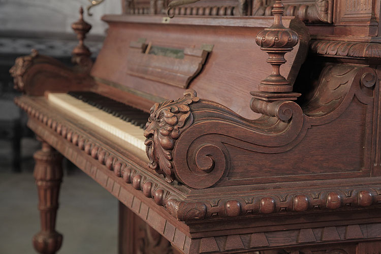 Georg Fortner  piano cheek, carved in an S-scroll features a decorative finial and a carved grotesque head