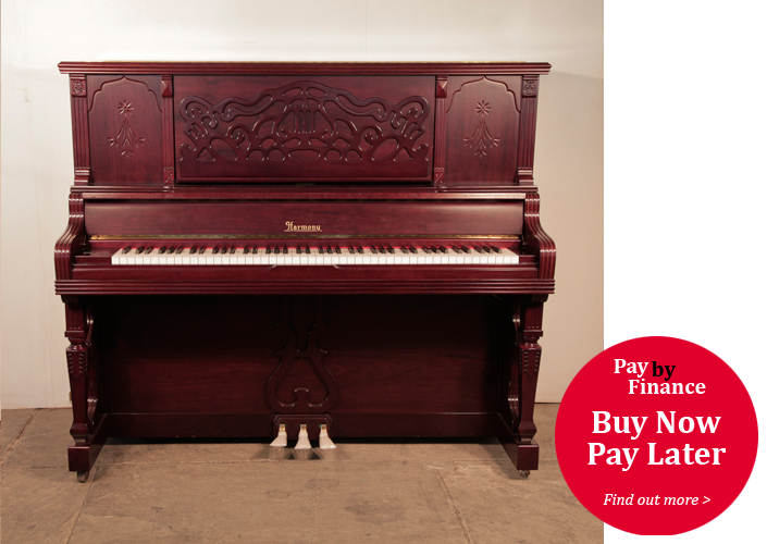 Harmony upright piano for sale with a polished, mahogany case. Cabinet features a carved, arabesque music desk and stylised carvings