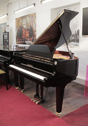 A Kawai GL-10 grand piano for sale with a black case and square, tapered legs