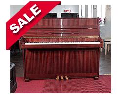 Reconditioned,  Opus upright piano with a mahogany case and polyester finish.