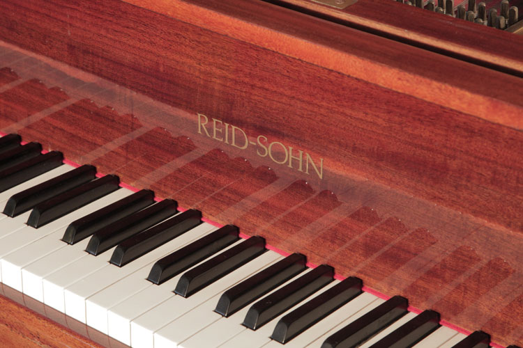 Reid Sohn piano manufacturers logo on fall.