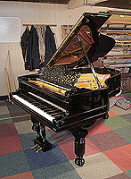 An 1880, Steinway Model A grand piano for sale with a black case, filigree music desk and fluted, barrel legs. Piano has an eighty-five note keyboard and a three-pedal lyre.