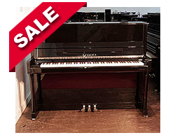 Piano for sale. Toyama Upright Piano For Sale with a Black Case and Chrome Fittings. Piano has an eighty-eight note keyboard and three pedals.