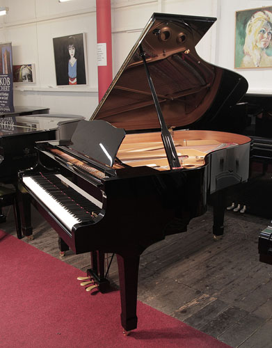 Yamaha C3 grand piano for sale with a black case and polyester finish.