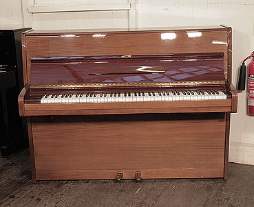  A 1976, Bechstein upright piano with a polished, mahogany case