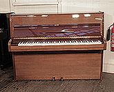 Reconditioned, 1976, Bechstein upright piano with a polished, mahogany case. Piano has an eighty-eight note keyboard and two pedals.