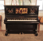 Piano for sale. A 1905, Brinsmead upright piano with a polished, black case and central panel featuring a crystoleum image of a Classical scene
