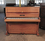 Piano for sale. A 1900, Broadwood upright piano with a polished, rosewood case and inlaid panel in a Neoclassical design