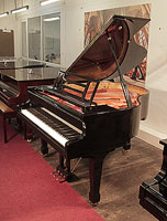 Pre-owned, Feurich Model 161 Professional grand piano with a black case, cut-out music desk and spade legs. Piano has an eighty-eight note keyboard and a three-pedal piano lyre.