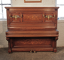 Albert Gast upright piano for sale with a quartered, walnut case and ornate, brass candlesticks. Entire cabinet inlaid in Neoclassical designs featuring scrolling acanthus, urns and flowers