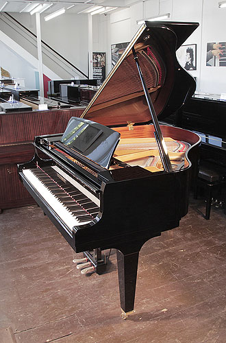 A Kawai GL-10 baby grand piano for sale with a black case and square, tapered legs