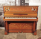 Piano for sale. An 1893, Pleyel upright piano with a satinwood case, brass candlesicks and fluted, column legs. Entire cabinet features intricate, Neocalssical style inlay of scrolling acanthus, flowers and foliage in a variety of woods. Piano has an eighty-five note keyboard and two pedals.