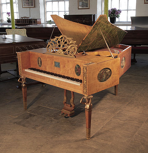 A 1918, Soren Jensen grand piano for sale with a maple case, ornately carved music desk and bronze nude, caryatid legs. Cabinet features hand-painted ovals by Danish artist Gudmund Hentze