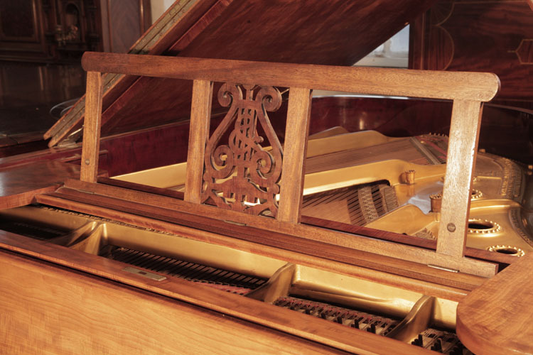 Steinway Model A   music desk in a minimal, geometric openwork design with central lyre motif. We are looking for Steinway pianos any age or condition.