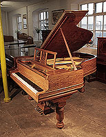An 1898, Steinway Model A grand piano for sale with a fiddleback mahogany case and barrel legs Piano has an eighty-eight note keyboard and a threes-pedal lyre.