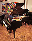 Reconditioned, 1935, Steinway Model B grand piano with a satin, black case and spade legs