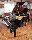 Piano for sale. Steinway Model B grand piano for sale with a black case, cut-out music desk in a geometric design and fluted, barrel legs