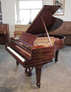 A 1928, Steinway Model M Grand Piano For Sale with a Polished, Mahogany Case and Spade Legs Piano has an eighty-eight note keyboard and a two-pedal lyre.