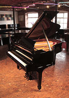 A 1932, Steinway Model M grand piano for sale with a black case and spade legs