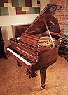Piano for sale. Reconditioned, 1966, Steinway Model S baby grand piano with a mahogany case and spade legs
