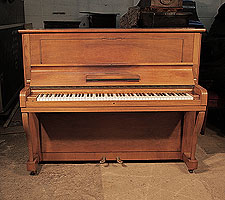 A 1957, Steinway Model V upright piano for sale with a walnut case and cabriole legs. Piano has an eighty-eight note keyboard and two pedals. 