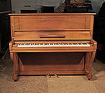 A 1957, Steinway Model V upright piano for sale with a walnut case and cabriole legs 