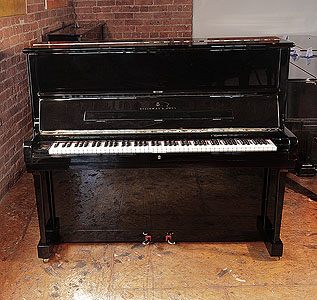 Besbrode Pianos is a Specialist Steinway & Sons  Dealer. A 1986, Steinway Model V upright piano with a black case and brass fittings