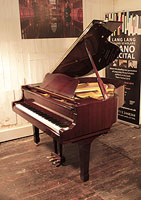 Reconditioned, 1992, Yamaha G1 baby grand piano with a mahogany case and spade legs. Piano has an eighty-eight note keyboard and a three-pedal lyre.
