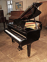 Reconditioned, 1973, Yamaha G1 baby grand piano for sale with a black case and square, tapered legs Piano has an eighty-eight note keyboard and a two-pedal lyre.