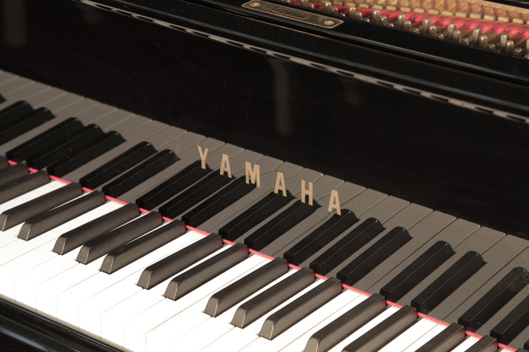 Yamaha G1  piano manufacturers logo on fall