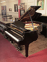 Reconditioned, 1975, Yamaha G2 grand piano for sale with a black case and spade legs.