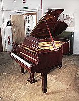 Reconditioned,  1993, Yamaha G2 grand piano with a mahogany case and spade legs. Piano has an eighty-eight note keyboard and a three-pedal lyre.