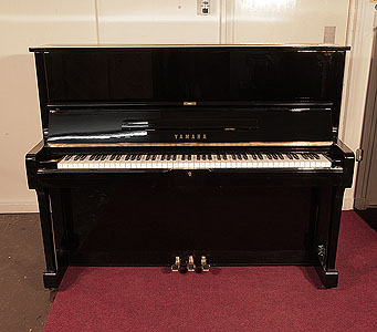 Reconditioned 1975, Yamaha U1 upright piano with a black case and polyester finish. Piano has an eighty-eight note keyboard and three pedals