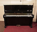 Piano for sale.  Reconditioned 1989, Yamaha U1 upright piano with a black case and polyester finish. Piano has an eighty-eight note keyboard and three pedals. 