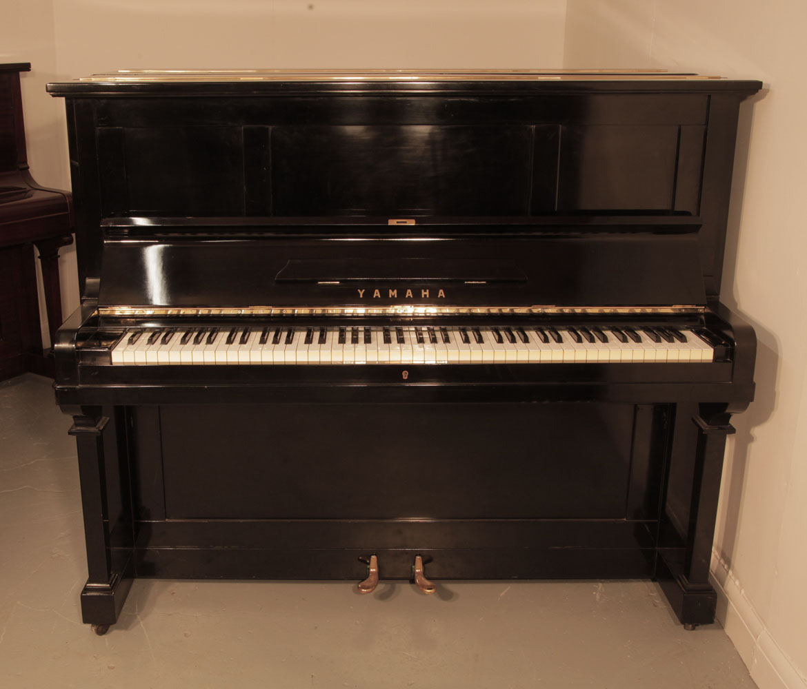 Yamaha U2 Upright piano for sale with a black case and brass fittings