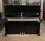 Piano for sale. A 1969, Yamaha U3 upright piano for sale with a black case and brass fittings. Piano has an eighty-eight note keyboard and three pedals.  