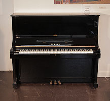 Reconditioned, 1979, Yamaha UX upright piano for sale with a black case and brass fittings