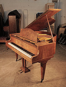 A 1930s, Bechstein Model S baby grand piano for sale with a figured, walnut case and square, tapered legs. Piano has an eighty-eight note keyboard and a two-pedal lyre. 
