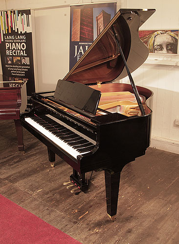 Piano for sale. Reconditioned 2009, Kawai GM-10K baby grand piano for sale with a black case and square, tapered legs