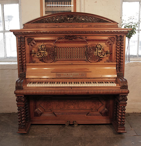 German Late Renaissance style, Pfaffe upright piano for sale with a walnut case, mock roll top piano fall and barley twist legs.