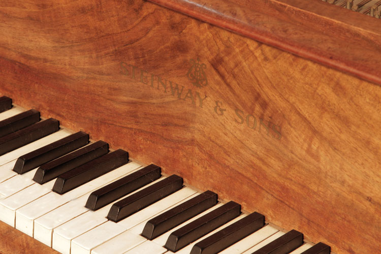 Steinway  Model S  manufacturer's name on fall. We are looking for Steinway pianos any age or condition.